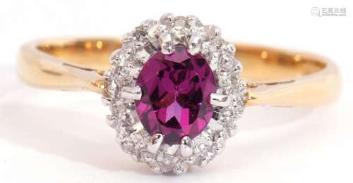 18ct gold amethyst and diamond cluster ring, the oval faceted amethyst multi-claw set and raised