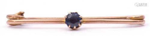 Antique sapphire set pin brooch, the circular shaped sapphire multi-claw set and raised on a