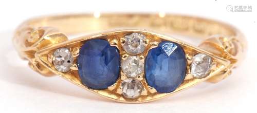 Early 20th century 18ct gold sapphire and diamond ring, featuring two old faceted sapphires,