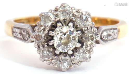 Diamond cluster ring centring an oval cut diamond of 0.20ct approx, raised within a diamond set