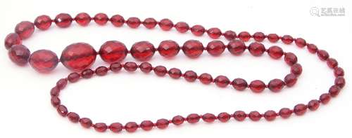 Vintage cherry amber faceted bead necklace, a single row of graduated oval beads, .5cm to 2.5cm