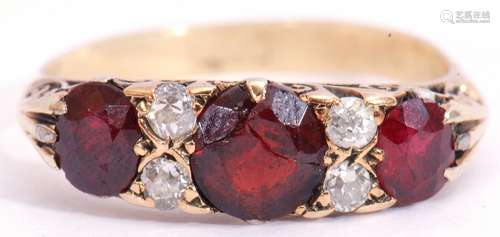 Antique garnet and diamond ring, having three graduated oval faceted garnets (centre stone cracked),