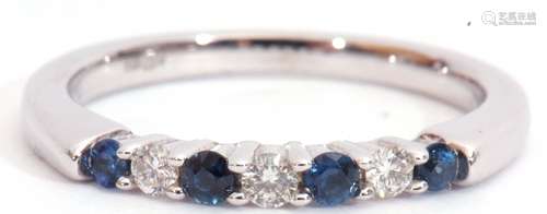 Modern sapphire and diamond ring, alternate set with four round cut sapphires and three round