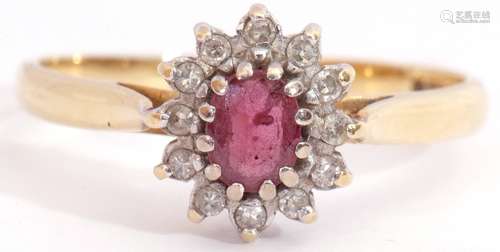 Ruby and diamond cluster ring, featuring an oval faceted small ruby, multi-claw set and raised