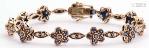 9ct gold sapphire and seed pearl bracelet featuring 21 links alternating with 11 sapphire clusters