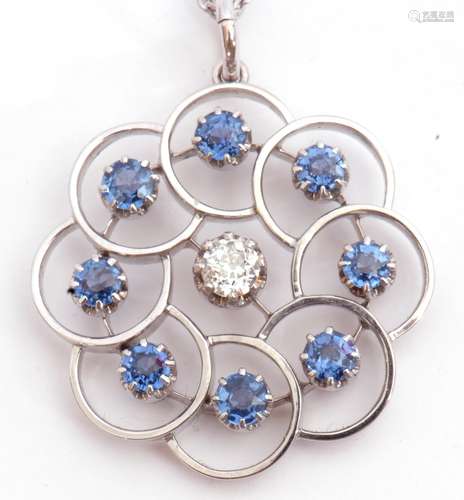 Precious metal, diamond and sapphire open work pendant on chain, centring an old European cut