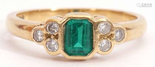 Modern 18ct gold, green stone and diamond ring, rectangular faceted cut green stone flanked by three