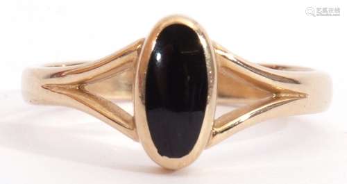 9ct gold and onyx ring, the oval shaped onyx panel in rub-over setting and raised between pierced