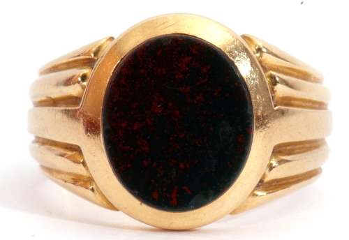 Antique gent's ring set with an oval cut bloodstone panel in rub-over setting, raised between