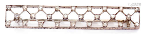 Diamond set brooch of elongated rectangular pierced form with a lattice work design, highlighted