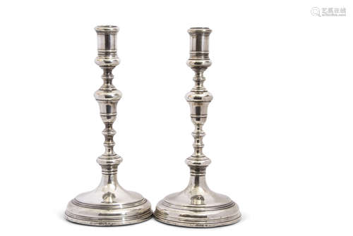 Pair of early 18th century style multi-knopped candlesticks, with loaded circular bases, base diam