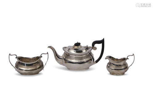 George V three piece tea set of compressed oval form with raised body bands, gadrooned rims,