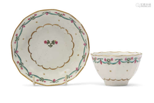 Lowestoft porcelain tea bowl and saucer, the fluted body decorated in polychrome with the Bungay