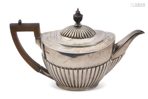 Victorian tea pot of three-quarter fluted oval form, treen finial and angular handle, Sheffield 1889