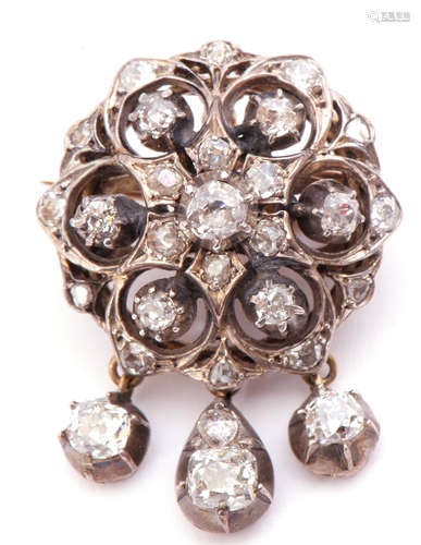 Victorian diamond cluster triple drop brooch/pendant, the circular pierced design with three