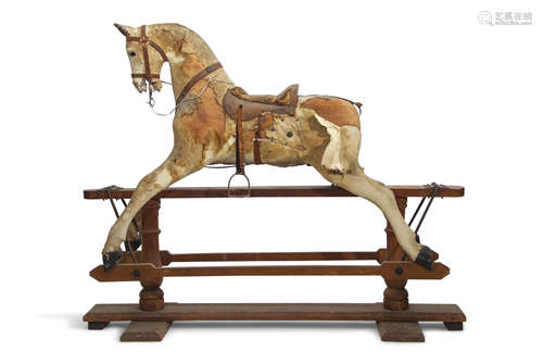 Vintage rocking horse (retailed by Hamleys) on a stained pine support (for restoration), 125cm high