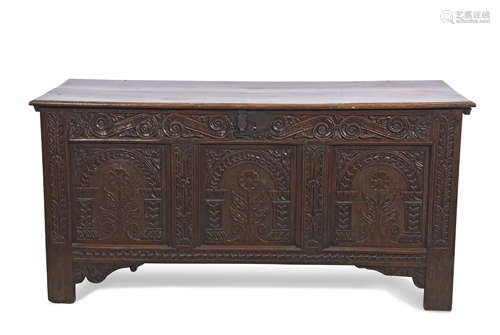 18th century oak coffer, two plank top over a three panel front carved with rosettes and arcaded