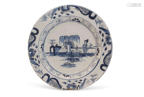 Mid-18th century Bristol Delft charger decorated with a chinoiserie design of a figure against a