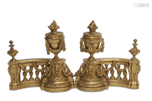 Pair of 19th century gilded andirons, crested with swag and urn capitals and the bases applied