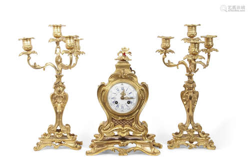 19th century French ormolu clock set in rococo taste, the clock with pierced gilt hands to a white