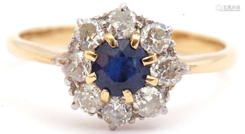 Sapphire and diamond cluster ring, the round cut faceted sapphire 5mm diam, multi-claw set and