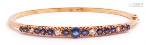 Sapphire and diamond hinged bracelet, the raised pierced gallery set with 13 round faceted sapphires