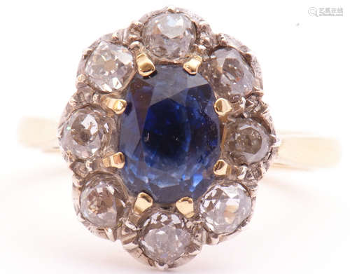 Sapphire and diamond cluster ring, the oval cut sapphire multi-claw set with 8 old cut diamond