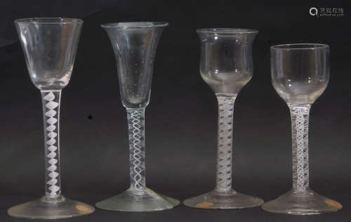 Group of 4 mid 18th century wine glasses, all with opaque/air twist stems, (4)
