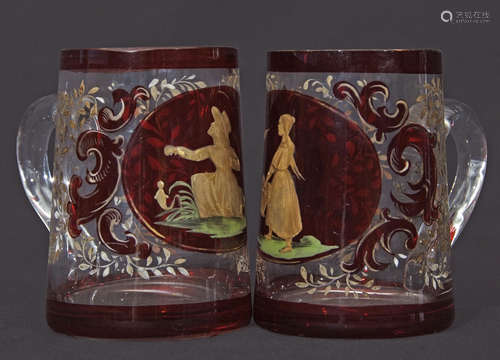 Two small glass tankards decorated in gilt with a young girl feeding birds, the other with a similar