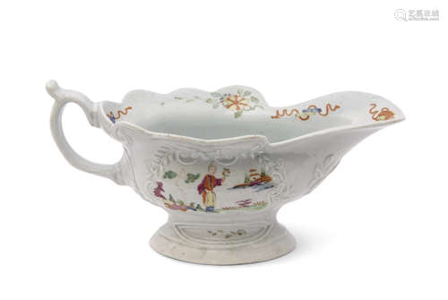 Small Worcester porcelain high footed sauce boat, circa 1755, the sides decorated in polychrome with