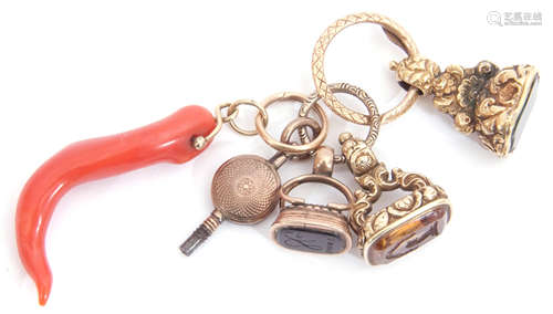 Group of three Victorian gold fobs, two with engraved detail, one plain, together with a watch