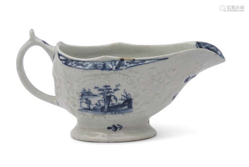 Small Lowestoft porcelain sauce boat with moulded decoration surrounding a cartouche with the little