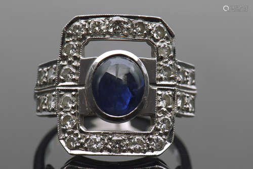 Sapphire and diamond dress ring, the carved open work rectangular panel centring an oval sapphire