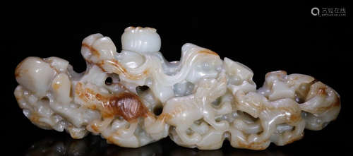 A HETIAN JADE PENDANT CARVED WITH BEAST