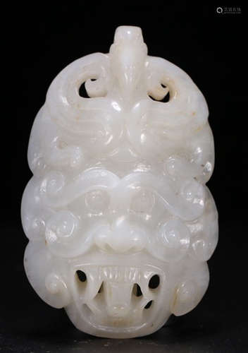 A HETIAN JADE PENDANT CARVED WITH BEAST PATTERN