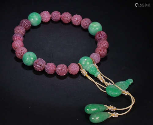 A RUBY STRING BRACELET WITH 18 BEADS