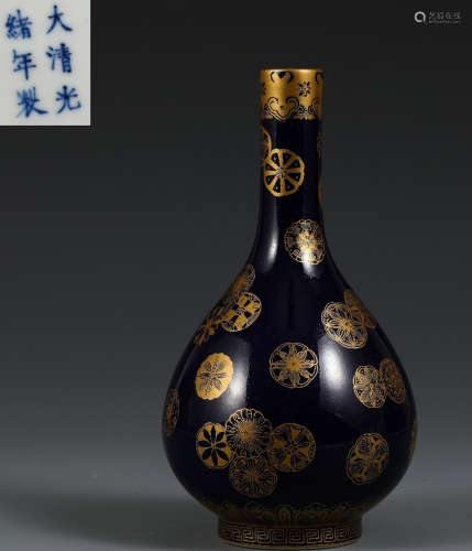 A BLUE GLAZE VASE PAINTED WITH FLOWER OUTLINE IN GOLD