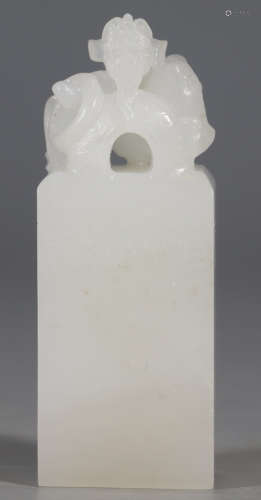 A HETIAN WHITE JADE SEAL CARVED WITH DRAGON