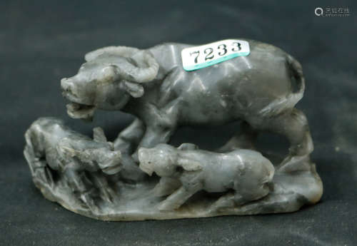 A HETIAN JADE CARVED BULL SHAPE PENDANT