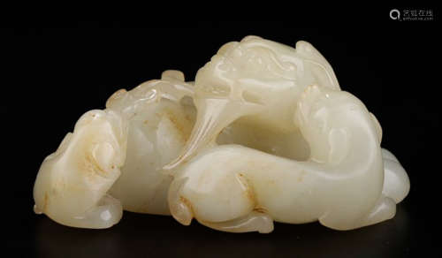 A HETIAN WHITE JADE BEAST PENDANT