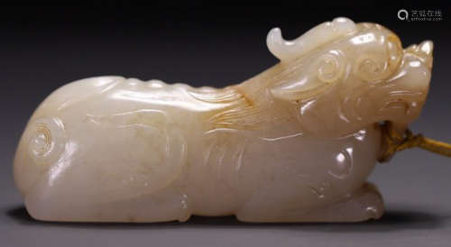 A HETIAN JADE BEAST PENDANT