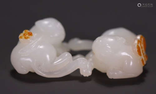 A HETIAN JADE BEAST PENDANT