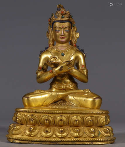 A GILT BRONZE BUDDHA STATUE EMBEDDED WITH GEM