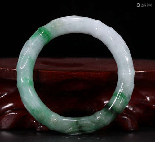 A JADEITE BANGLE CARVED WITH BAMBOO