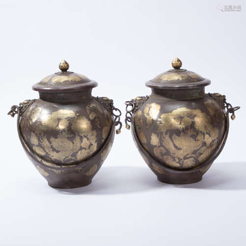 A PAIR OF CHINESE SILVER GILT JAR COVERS