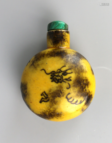 a chinese porcelain snuff bottle, yellow glaze