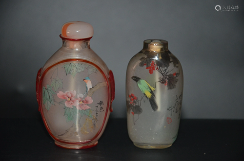 a pair of snuff bottles with painted crystals