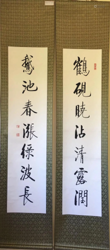 a chinese calligraphy on paper couplet