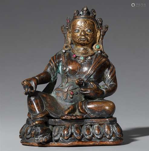 Jambhala. Dunkle Bronze mit Silbereinlagen. Tibet oder Nepal. 17./18. Jh.