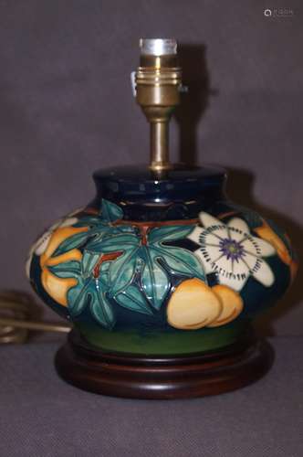 A Moorcroft lamp on a wooden base